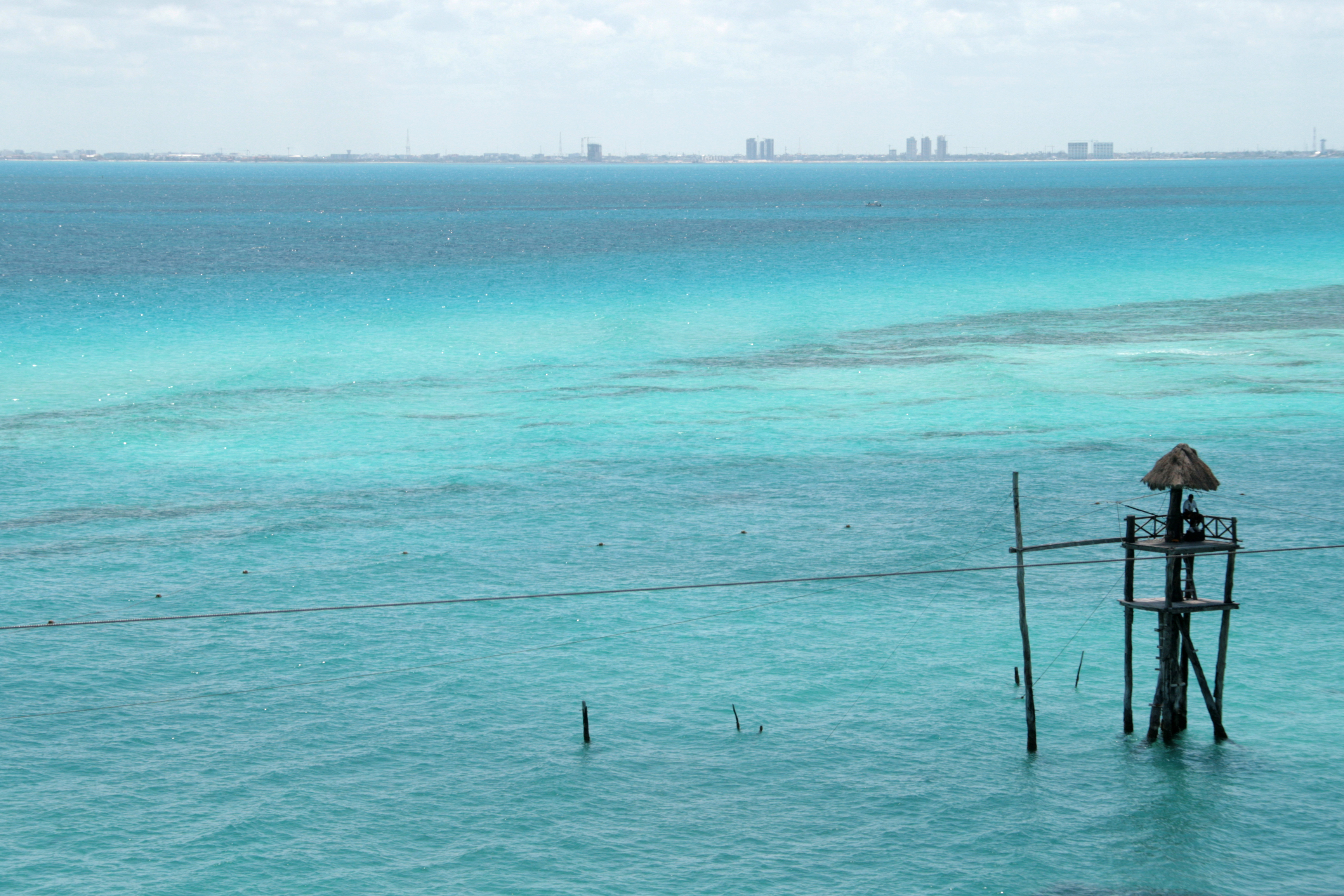 From Isla Mujeres island Cancun is seen as a monstruous and artificial hotel complex.